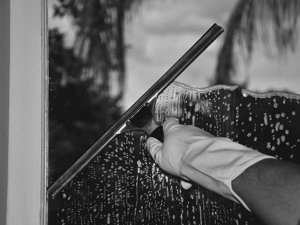 Window cleaning with squeegee